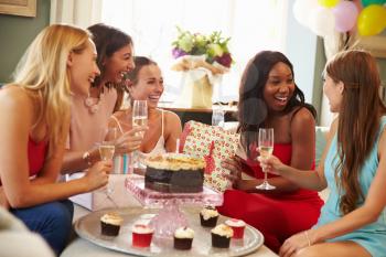 Group Of Female Friends Celebrating Birthday At Home