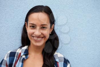 Head and shoulders portrait of smiling Hispanic woman