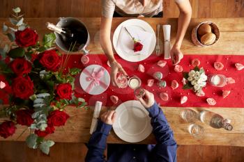 Overhead View Of Romantic Couple At Valentines Day Meal