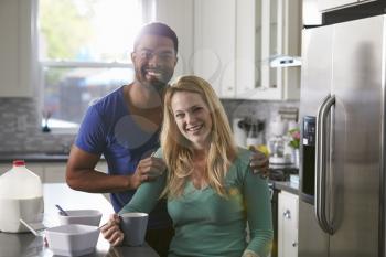 Portrait of mixed race couple in their kitchen