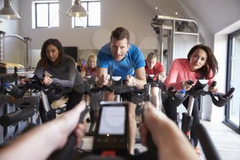 Instructors POV of spinning class at a gym