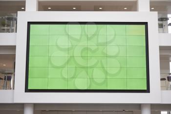 Big screen, AV monitor, in a university lobby atrium