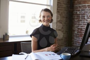 Portrait Of Businesswoman Working In Office