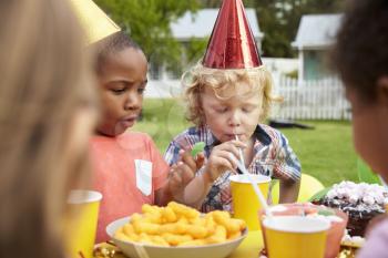 Children Enjoying Outdoor Birthday Party Together
