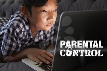 Boy Using Laptop with Parental Control Message