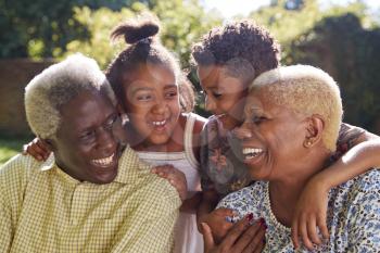 Senior black couple and grandchildren outdoors, close up