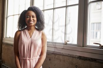 Smart young black businesswoman smiling to camera