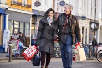 Mature Couple Enjoying Shopping In City Together