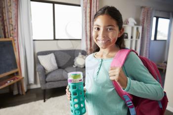 Portrait Of Girl With Backpack In Bedroom Ready To Go To School