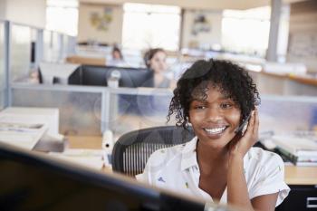 Young black woman working in a call centre