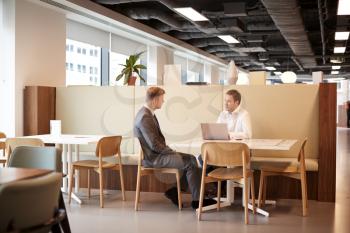 Young Businessman Having Informal Interview In Cafeteria Area At Graduate Recruitment Assessment Day