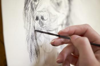 Close Up Of Artist Sitting At Easel Drawing Picture Of Dog In Charcoal