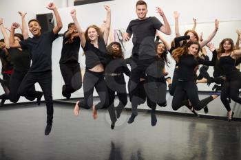 Male And Female Students At Performing Arts School Rehearsing Street Dance In Studio