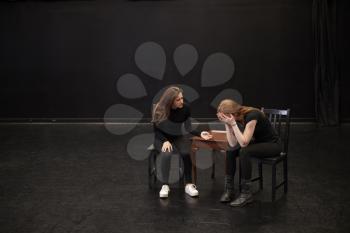Two Female Drama Students At Performing Arts School In Studio Improvisation Class
