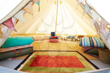 Interior View Of Teepee Tent Pitched On Glamping Camp Site With No People
