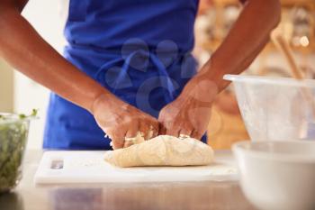 Close Up Of Woman Kneading Dough In Kitchen Cookery Class