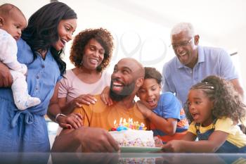 Multi-Generation African American Family Celebrating Fathers Birthday At Home Together