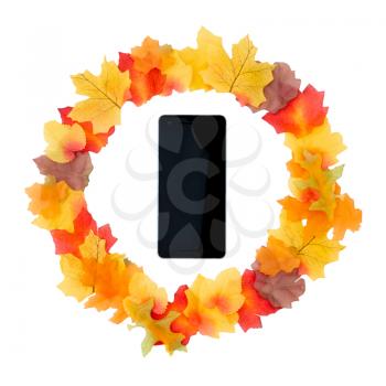 Autumn Still Life Of Leaves And Pine Cones Arranged A Circle Around Mobile Phone On White Background