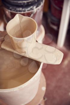 Close Up Of Mixture For Glazing Pots In Ceramics Studio