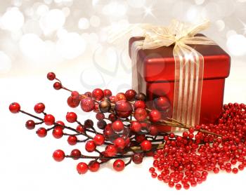 Chrustnas gift background with red berries and beads