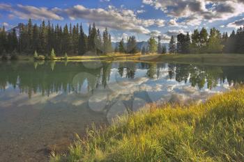 Royalty Free Photo of a Shallow Lake by Mountains