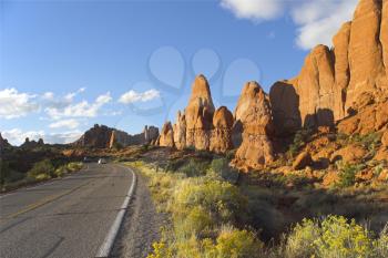 Royalty Free Photo of a Highway Along Rock Formations