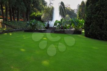 The fountain at the lovely grassy lawn.  A masterpiece of garden architecture - a park on Lake Maggiore
