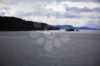 Motor boat in passage at coast of island Vancouver