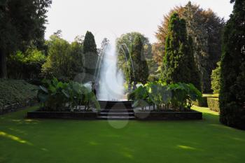 The fountain at the lovely grassy lawn.  A masterpiece of garden architecture - a park on Lake Maggiore