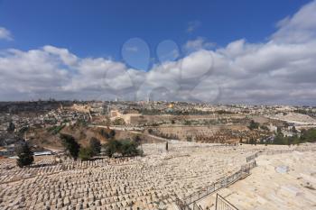 An ancient cemetery in Jerusalem on the Mount of Olives. View on Jerusalem and the golden dome of a Muslim mosque
