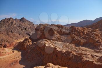 Ancient mountains of stone desert. Israel, mountains of Eilat, coast of Red sea