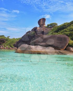 Huge beautiful reefs and cliffs on the banks of the Blue Lagoon. Rest on the Similan Islands, Thailand
