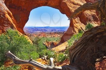  An arch in National park  Arches through which the panorama of a valley is visible