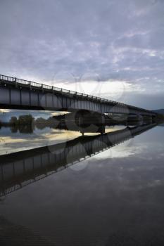 The metal bridge in light twilight of rainy day