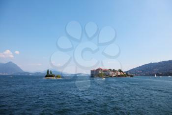 Charming little islands in Lake Maggiore, photographed with a tourist pleasure boat
