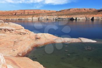 The blue and turquoise water in the desert rock. Bottling magnificent Lake Powell photographed by Fisheye lens