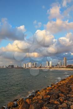 Magnificent panorama of the waterfront promenade in Tel Aviv. Sunset on a windy and cloudy day in May