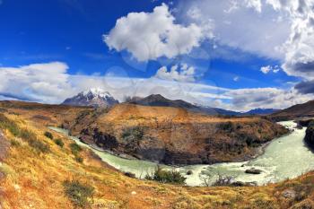 Travel to Chile. The river bends a horseshoe under the flying clouds. The picture was taken Fisheye lens
