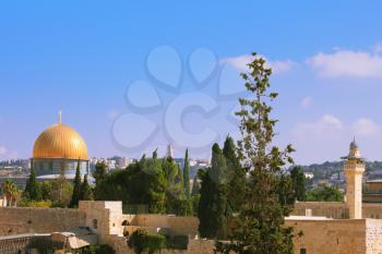 The Holy City of Jerusalem is lit by the morning sun.  Golden Dome Mosque of Caliph Omar