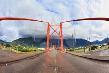 Patagonia, Chile. Red bridge over the fjord. The picture was taken Fisheye lens
