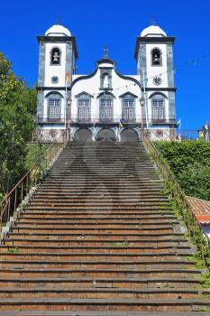 Sights of the Portuguese island of Madeira. Magnificent white church of Nossa-Senior-du-Monty. To the building the long picturesque ladder conducts