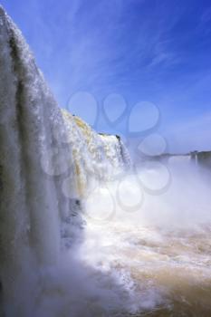  White whipped foam of water and a thin mist over the water. The most high-water waterfall in the world - Iguazu. The picture is taken by lens Fisheye