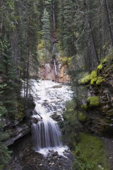 Magnificent cascade falls in park Johnson in the north of Canada