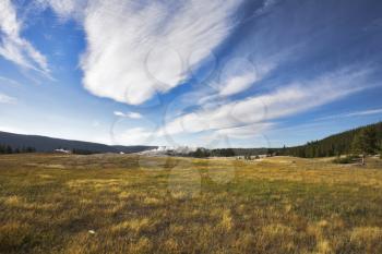 
Quaint clouds above meadows of Yellowstone national park 
