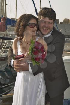  The beautiful, happy groom and the bride on prewedding walk in ancient to port.   