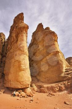 The tourist at bottom huge rocks of the freakish form in Park Timna in Israel