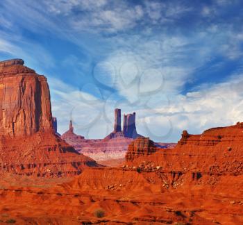 Magic view of the red desert. The unique red sandstone buttes mitts. Monument Valley in the Navajo Indian Reservation. Arizona, USA