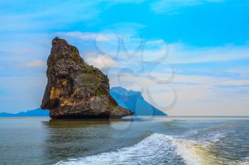 Island Sail in the Andaman Sea. Fantastic beauty island-rock in the southern seas. The photo was taken from a fast sailing boat