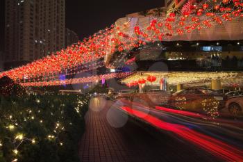Night street. Richly decorated hotel in the Chinese city before New year