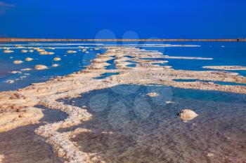 Dead Sea off the coast of Israel. Vaporized salt form whimsical patterns on the surface water